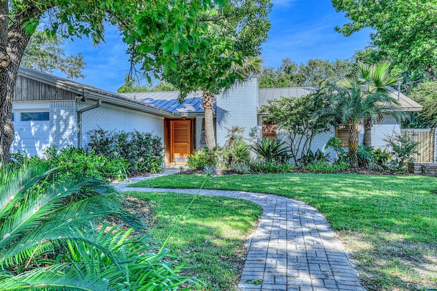 Must see, completely renovated 3 bedroom/3 bath home in the heart of Destin! Every inch of this home has been renovated by the Seller over the past few years, including bathrooms, kitchens, flooring, and the backyard. Even the ceiling in the living room was vaulted. Split floorpan with gas fireplace. Top of the line Viking appliances. Tankless renai water heater for instant hot water. Seller has agreed to leave his sound system valued at $10,000 at the time of purchase. Steam in the Master Bedroom full body shower .  The garage is heated and cooled with its own AC unit.  Brand new heavy duty motor has been installed to handle the custom garage doors.  The windows have custom mahogany hurricane shutters. Escape to your private backyard oasis to cool off in the pool while entertaining on a hot day, or heat the pool and enjoy the pool side fire pit on a cool winter night. Brand new pool heater!  Outdoor Kitchen with natural gas grill and sink with hot/cold running water.  The gas has been run from the house to the grill, so no more picking up tanks when empty.  Brand new trex decking.  30 ft easement behind the house with bamboo growing naturally to provide complete privacy.  Outdoor fire pit is also gas that has been run from the house.  Just flip a switch!  Plenty of parking with a 2 car garage and space for 6 additional cars on the paver driveway.  No detail left untouched from light bulbs to landscaping, this home is move-in ready!