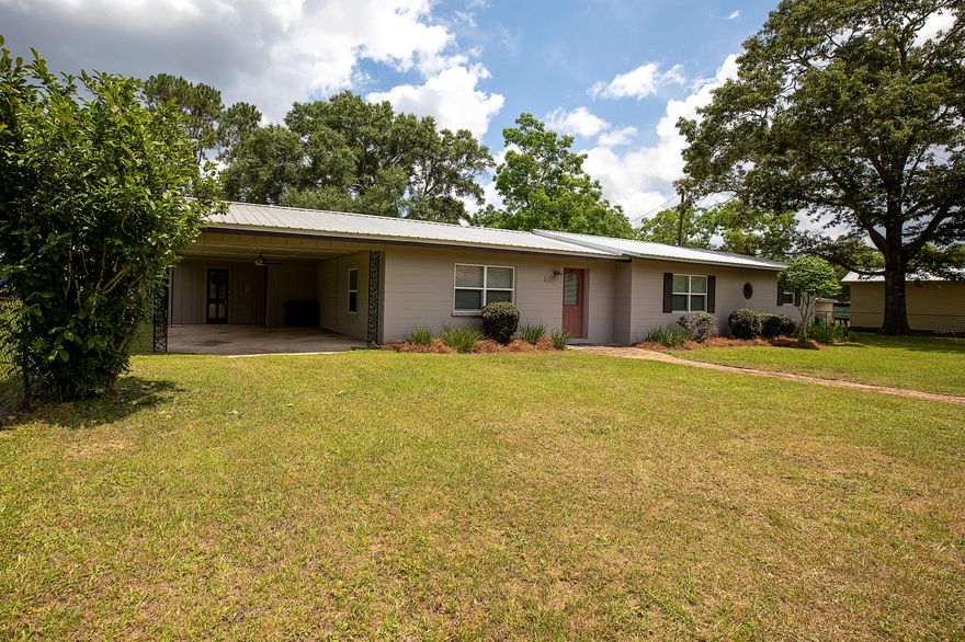 This 3 bedroom, 2 bath home has been remodeled and is move in ready. This home has a large fenced in yard, great living area, mud room, carport and more. This home is a short distance to schools and a recreation center. Enjoy the parks and bring your boats and ski's for all the aquatic fun the area has to offer!