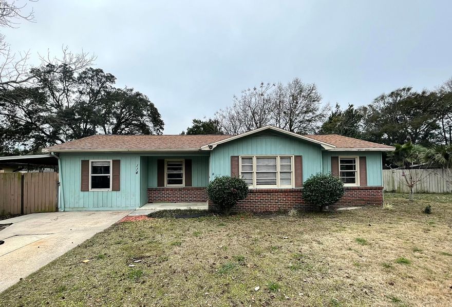 This adorable 4BR/2BA home is centrally located in Fort Walton Beach and ready for a loving family to add their personal touches and make it their own! Home features a split floor plan with master on one side and 3 smaller bedrooms on the other. Kitchen has tile flooring and stainless steel appliances. New HVAC (2016). Roof is in good condition. The entire home exterior, including roof, was recently pressure washed. Home currently needs flooring in the main living room, hallway, and bedrooms, otherwise it is move-in ready! Property to be sold AS-IS. Seller will consider a cash concession or adding desired flooring, with an acceptable offer. More pictures to come.