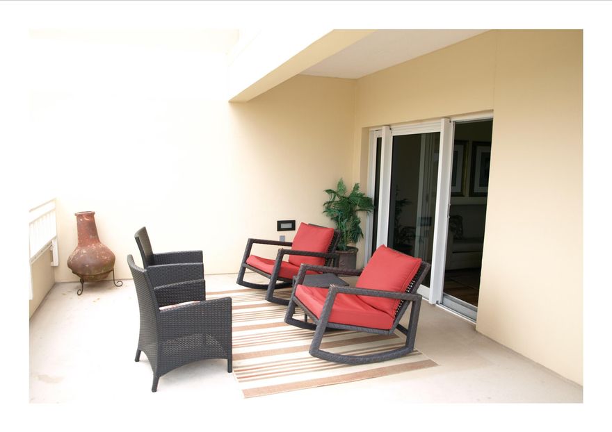 Enjoy the coastal sea breeze from this resort home's large, open terrace furnished with comfy places for relaxing and entertaining. Freshly painted with tile plank flooring that flows throughout for easy maintenance. The lock-off layout means you can use the condo in a full two bedroom, two bath configuration or separately as a one bedroom, one bath and a studio. New hot water heaters were installed in 2015. Luau offers exceptional amenities for you and your guests to enjoy; such as a lagoon style pool with a swim-under waterfall, a fitness center, outdoor gas grills, and easy beach access.