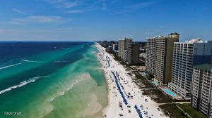 Updated Direct Gulf Front, Low Floor 1BR/2BA plus BUNKS located in Renovated Twin Palms Complex. Recent Upgrades: Furniture & AC. This unit is sold fully furnished and has an awesome gulf front bowed balcony, it's own laundry room, all tiled flooring, no carpet in this one! Crown molding, custom cabinets, 2 bathrooms & separate bunk area. Sleeps 6. Unit is booked solid until September. You can start making money the day you purchase! Twin Palms has been freshly painted and looks wonderful, lobby areas remodeled, parking gulf side in coded parking garage. Near Walmart, Convenient to shopping, Entertainment, Restaurants and Fine Dining. This unit offers you or your guest the opportunity to Relax and enjoy the complexes Large Lap Pool, Extra Large Hot Tub, BBQ Facilities, Sauna/Steam Room and Fitness/workout room and fabulous sunset views! Just a few minutes to Pier Park Shopping. Don't miss out on this one!!!