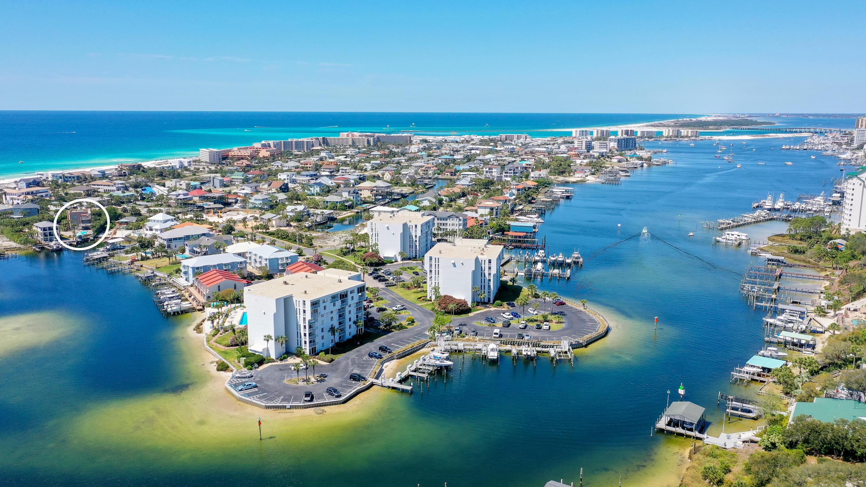 This unique home is truly one of a kind, from the open entertaining spaces, rooftop deck with gulf views and high-end finishes to the oversized pool and boat dock with lift on the Destin Harbor and walking distance to the beach. It is a private retreat that truly has everything and more needed as a home or income producing property all in a highly desirable location. This luxurious and sleek 3 bedroom, 4 bath, 3-story home has over 3590 square feet of living space and sweeping views of the harbor. Each floor has been designed for optimal enjoyment while capturing and highlighting the beautiful surroundings. The main entrance into the home on the 2nd floor opens to the living area, which has a fireplace, built in entertainment center, cocktail bar with ice maker,