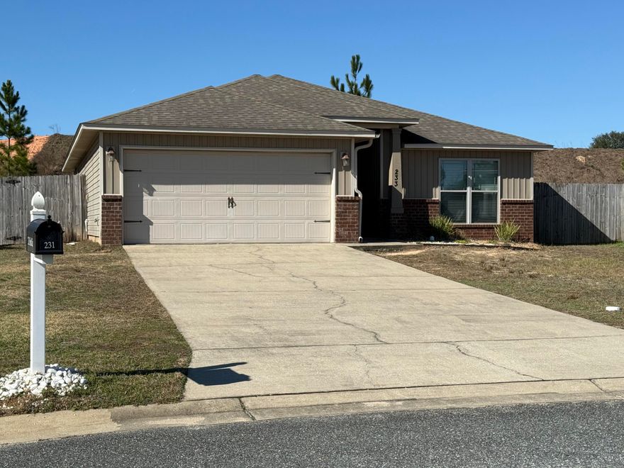 Located south of the interstate, this lovely 3-bedroom, 2-bathroom home is ready for you. Upon entering, you will immediately notice the spacious open floor plan accented by cathedral ceilings. The kitchen features a large breakfast bar, stainless steel appliances, extensive cabinetry, and an ample pantry. A large dining area is conveniently located just off the kitchen.Double doors lead to a primary suite spacious enough for oversized furniture. The attached bathroom is complete with a double vanity, a separate shower with glass doors, a water closet with a linen closet, and a large tub area. A generous walk-in closet is located just inside the bathroom.Outside, you can enjoy beautiful Florida sunsets from the large backyard and covered patio, perfect for hosting afternoon BBQs