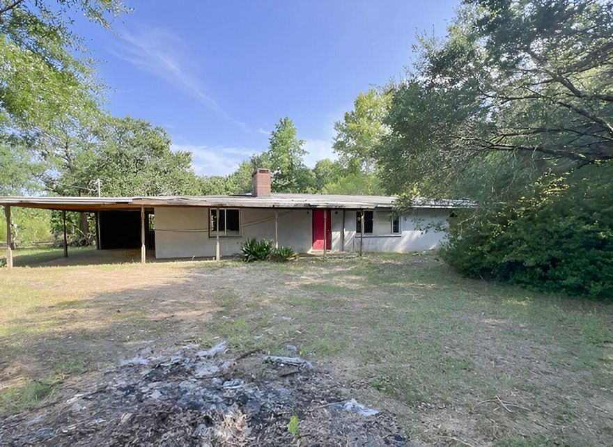 Located on a hard to find nearly 2 acre parcel, this large REO home might be one to consider! Built originally in 1949, very few updates have been done since that time. Home's exterior cinder block and inside the home has 2 wood burning fireplaces. There is only 1 bath in this home but the bedrooms are certainly oversized for this year. Homes living room, kitchen, dining, and den area are also quite large, square footage wise. Home's ceilings and walls are original tongue and groove. The home needs major repairs and will not qualify for financing so cash or rehab loans only. Lots of potential!
