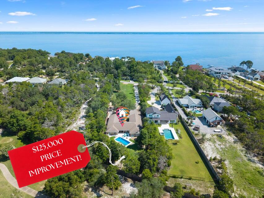 Just reduced $125,000! Priced to sell!! Do not wait -- schedule your appointment today to come and see this incredible opportunity located at 497 Walton Way. Situated on over an acre with no HOA -- the opportunities are endless. Plenty of space to add a detached garage, carriage house, boat/RV parking and so much more. Walton Way is a quiet, dead end street with little traffic on this far west end. Easy access to the bay, new park and the beautiful beaches of South Walton and Destin. This home offers over 3,500 square feet of classic Florida living. With three bedrooms, plus a smaller fourth bedroom (currently being used an office) three full baths, a lovely Florida room with access to the pool surrounded by a beautifully landscaped yard. This private estate backs up to the Emerald Bay Golf Course and is sure to impress!