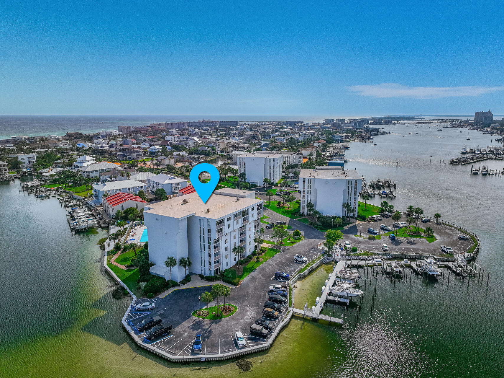 PENTHOUSE WITH VIEWS OF THE GULF OF MEXICO AND ENTIRE DESTIN HARBOR!  This unit also conveys with a 16 x40 Boatslip and 2 Waverunner Lifts.This rare & unique top-floor, Southeast facing condo offers huge 3 bedrooms, 1870 sf of living space with a covered patio with unsurpassed views!   This end-unit with its unique floor plan has extra windows offering more natural light. Extra storage on premises.  Dolphin Point amenities include a community pool, tennis courts, barbeque grills, a waterfront clubhouse and coveted deeded beach access.  Must see to appreciate!