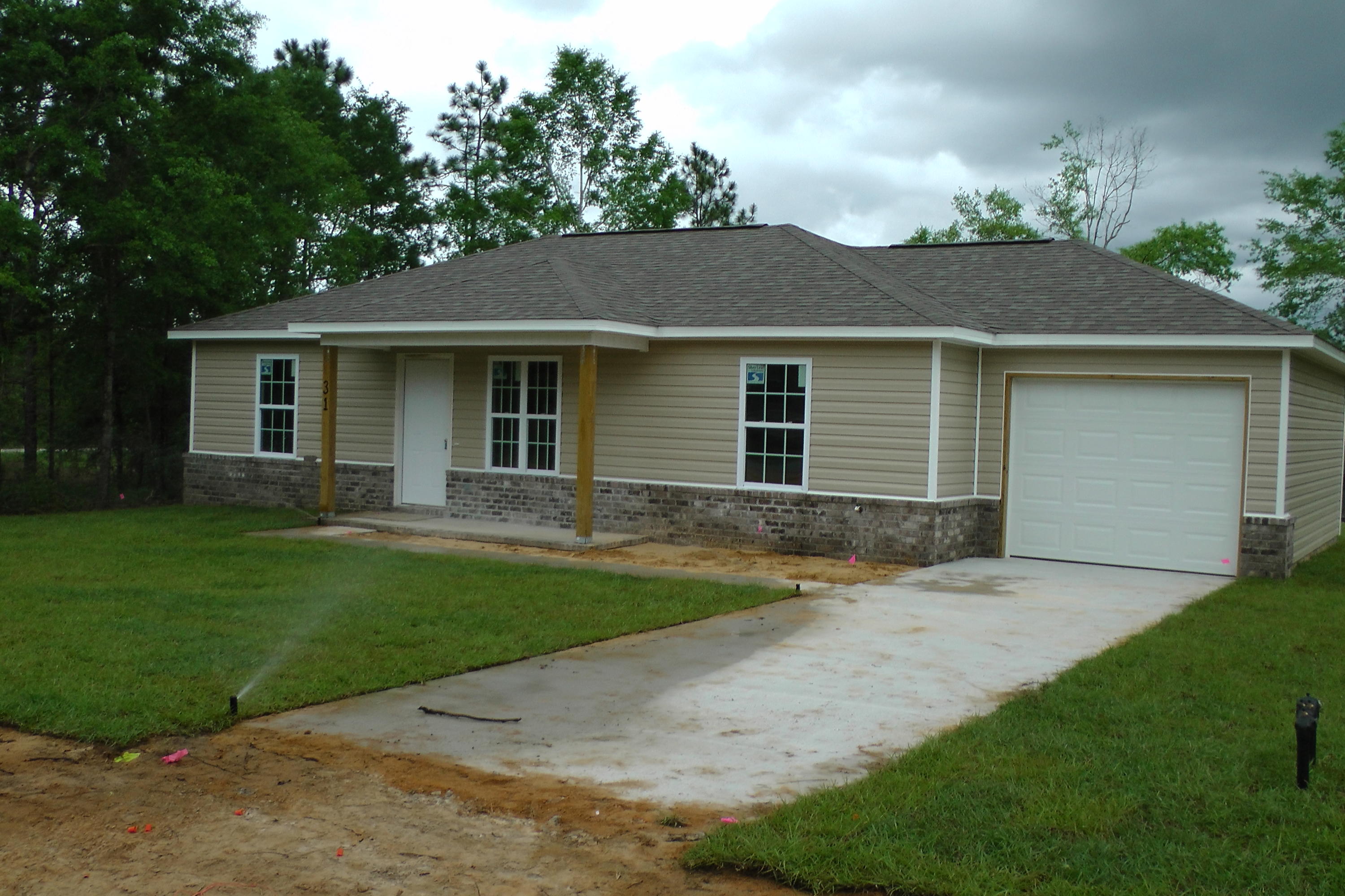 A Jay Terrell Home of Quality construction - good now and for resale! Vinyl with Brick Skirting at Front, with vinyl trim and dimensional shingles. Tile Foyer, Baths, Kitchen and Dining Area. - Split Bedroom Plan - 10 X 12 Deck looking out to approx. 6 acre lake, 4 X 14 Covered Front Porch. Large Pantry off Kitchen,solid surface range,granite kitchen counter tops; built in micro-hood! Walk-in Closet in Master BR. Great lakefront lot has gentle slope to lake. Really Pretty! Vacant lot to Right also for sale. List Agent is related to Seller but holds no interest in property.