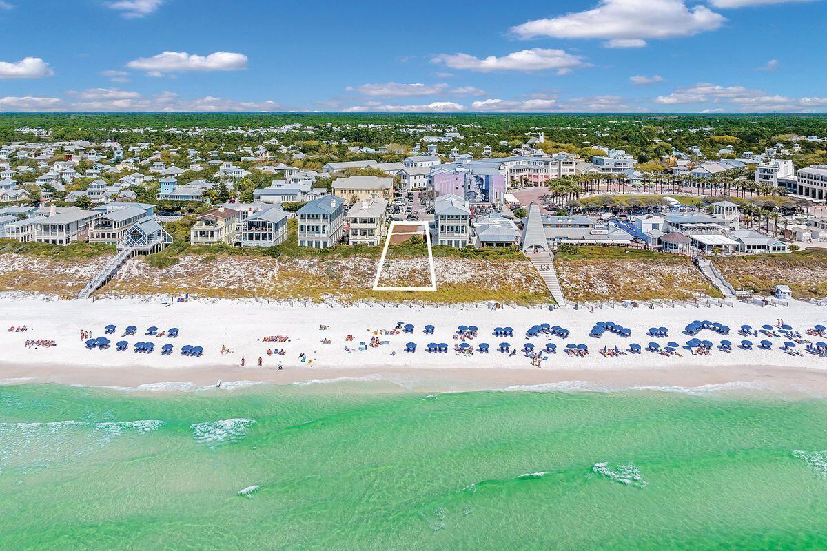 Craft your bespoke seaside sanctuary on the last available gulf-front lot in Seaside, Florida. This unparalleled plot invites you to envision a stunning three-story main cottage accompanied by a charming two-story guest cottage atop the garage, promising an expansive living space of more than 5,200 square feet. Envision three sprawling covered porches, each offering serene views of the gulf, set within a design that permits robust all-concrete construction -- a testament to both luxury and durability. Nestled just steps away from the Town Center, this lot sits at the epicenter of Seaside's vibrant life. A mere stroll across to Seaside Central Square unveils a world of shopping, dining and entertainment options, placing you in the heart of it all. Whether you're contemplating a primary residence, a secondary getaway, or a lucrative rental investment, this spot is unmatched in its offering. The Seaside community enhances this rare find with access to a fitness center, tennis and pickleball courts, and multiple pools, ensuring a lifestyle filled with leisure and activity.