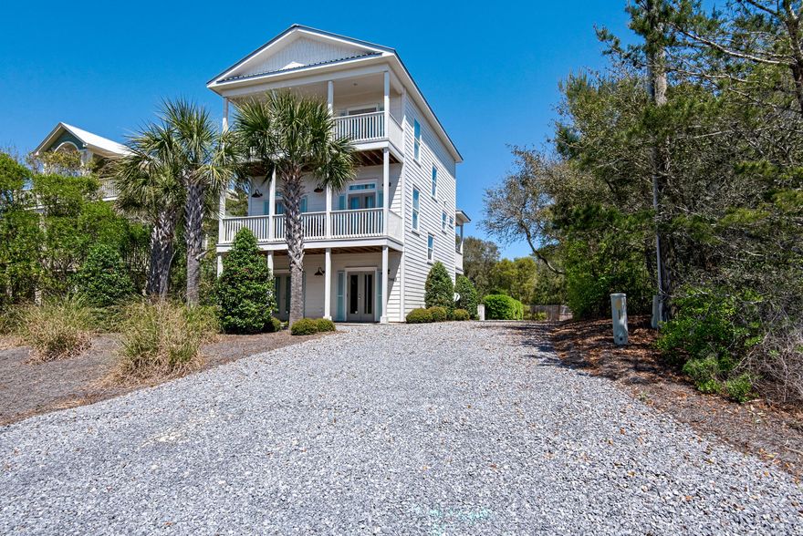 Stunning 3 story home with private pool, just a short stroll to the beach in Seacrest. Never rented, and lightly used, this home lives like new construction, and affords gulf views from the upper level. Beautiful touches throughout the home, complete with a stunning furnishings package from Beau Interiors. The first floor has 2 bedrooms and 1 bath with custom designed brick tiled floors. Leading up the second floor, you will be delivered by the beautiful hardwood lined staircase to the open floorplan of the living/dining/kitchen area. Shiplapping on the walls compliments the light and bright feel of the space with warm dark wood floors for contrast. The abundance of outdoor space begins to become apparent with porches on both the north and south side of the home. There's also a half bath