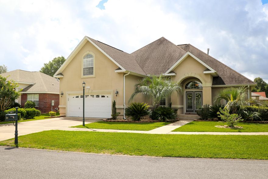 Gated community in South Crestview located 15 mins from 7th Group/Duke Field &30 mins from the beautiful Emerald Coast! Gorgeous curb appeal on a corner lot. Double door entry into this impressive open floor plan. Large beautiful foyer with formal dining room to your left with floor to ceiling tapered columns, trey ceiling with accent lighting. Family room with tiled gas fireplace and built in bookcases. A beautiful open kitchen with granite counter tops, breakfast bar, pantry, cherrywood cabinetry and additional dining area. This home has a split bedroom plan with very large master suite with bay window, lots of wall space for larger furniture and trey ceiling with romantic accent lighting. Master suite has his and her large walk in closets and a master bath w/double vanities, whirlpool