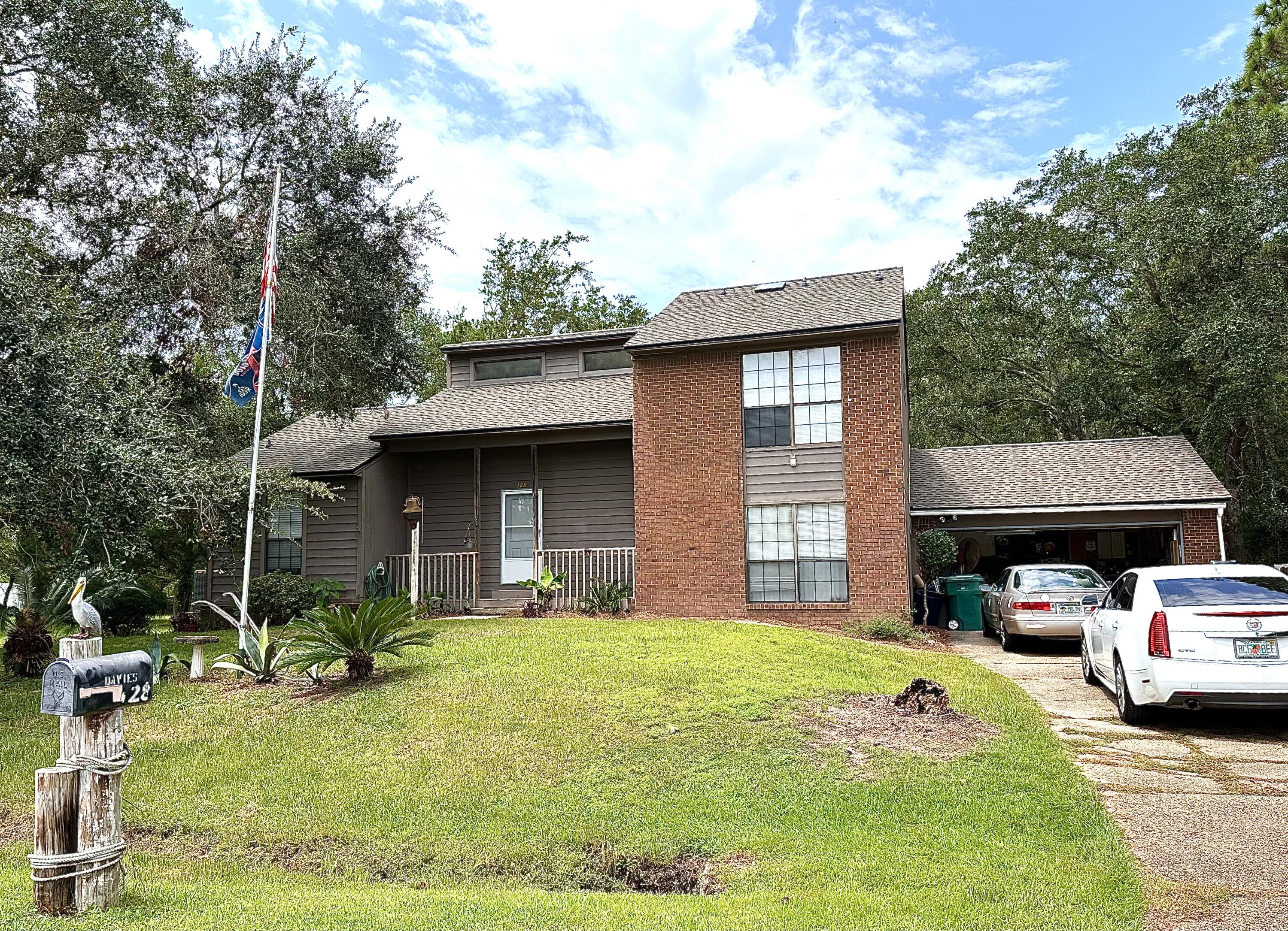*ACCEPTING BAKUP OFFERS!*HUGE PRICE REDUCTION! Under contract with 72-hour kick-out clause. Want a home with bay access across the street and a huge lot with room for all your toys? This home is located in Dolphin Cove Estates between Niceville and Freeport, only 15 minutes to everything Niceville and Destin have to offer! Bring your boat and RV, there's room for everything! Like to kayak or paddle board? Just cross the street and you're in the water. No neighbors on either side and Eglin reservation in your back yard means privacy galore. PLUS no HOA and no water bill (has well water and access to city water if you so choose). There are two bedrooms on 1st floor and the master and extra bedroom upstairs which could be turned into a huge master bedroom suite. Walk the shoreline to Nick's