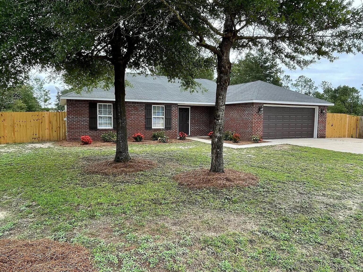 Wonderful 4 bedrooms 2 bath home with 2 car garage, large fenced back yard conveniently located near Hwy 90. Open floor plan with split bedrooms. Home features luxury vinyl planks throughout and tile in the kitchen and bathrooms.