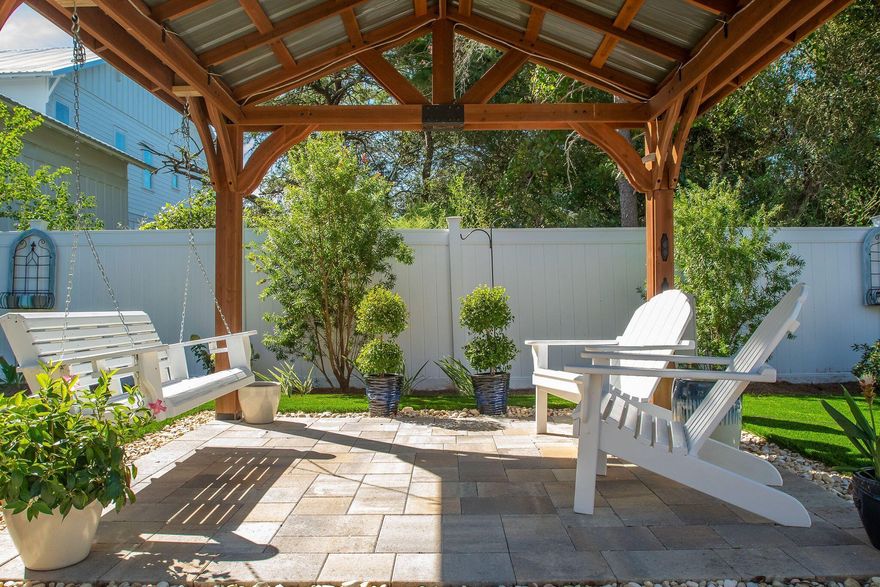 Multiple Lifestyle opportunities all within 1200 feet to one of the many beach walkovers!  One of the features of this Craftsman style home is an incredible, fully fenced backyard complete with a Pergola covered lounging space, hot tub, covered porch and a maintenance free ''artificial turf'' lawn.  Entering the home you are greeted with a beautiful solid wood front door, Crown molding throughout, multiple Archways, Tiled floors in the main areas and plenty of natural sunlight! Open contemporary floor plan comes fully furnished in excellent condition, ready to move in. 
Double car garage with Epoxy covered flooring and plenty of storage shelving. 
Exterior has Hardie Board siding with drip line irrigation system in all landscaping beds.  See more notes. Low E-Energy saving windows, Attic insulation rating R-38, Walls R-13.  Fully PAID for solar panels located on the South and West sides of the roof...average monthly power bill $30.-$40.  Interior and Exterior security cameras to be conveyed with purchase.  No HOA. Short Term Rentals are approved. House plans are included.
Driveway including additional parking covered with beautiful brick pavers.  85" TV in the living room...perfect for game days! All room size measurements are to be verified by Buyers if important.