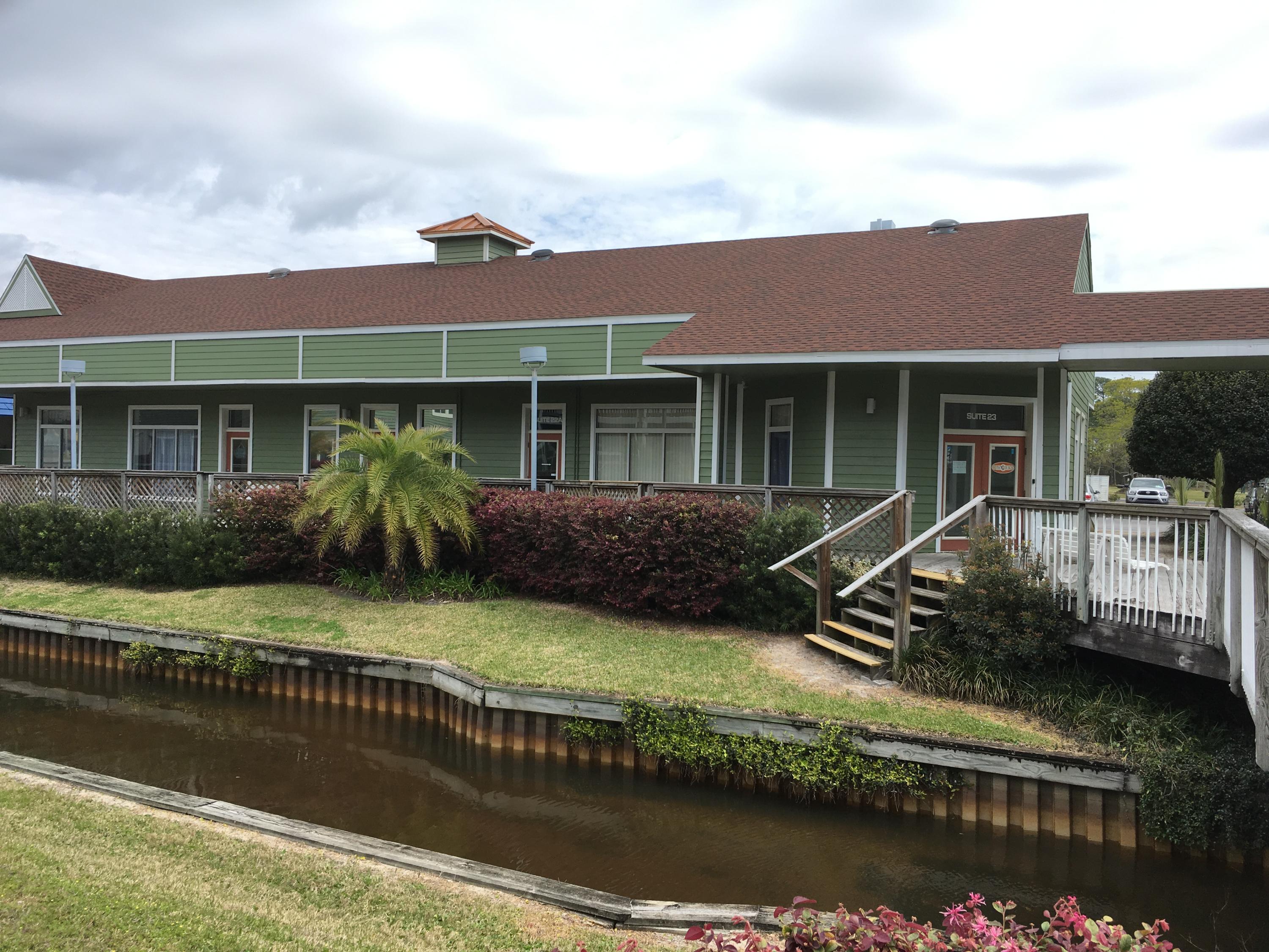 Corner unit with new flooring and paint. Reception area, 5 private offices and conference room.