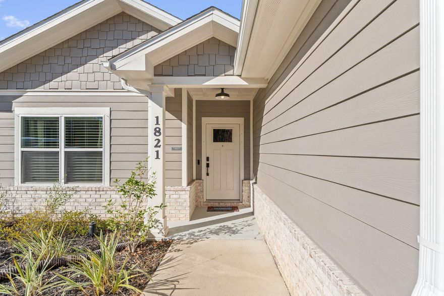 Stunning 4BR/2BA home built in 2022, ideally located in Midway/Gulf Breeze with NO HOA and NO rental restrictions. Step inside to a wide foyer with Bedroom #1 conveniently located to the left. The open-concept living area features high ceilings, recessed lighting, and a ceiling fan, seamlessly flowing into the modern kitchen. The kitchen boasts white shaker-style cabinets with soft-close doors and drawers, a large quartz island with pendant lighting, stainless under-mount sink, spacious lighted pantry, and stainless-steel Whirlpool appliances.The bright dining area offers a tray ceiling and access to the covered back porch--perfect for indoor/outdoor living. Luxury vinyl plank flooring runs throughout the entire home, including all four bedrooms The spacious primary suite features a tray ceiling, recessed lighting, and ceiling fan. The en-suite bath is accessed through a pocket door and includes a large tiled shower, double quartz vanity, private water closet, and a pocket door leading to the walk-in closet. Two additional bedrooms feature ceiling fans and double-door closets. A centrally located laundry closet includes stylish barn-door access.

Additional upgrades include 9' ceilings with 10' tray ceilings, 6" baseboards, 1x4 trimmed doorways, and a fully finished garage with painted walls and epoxy floors, pull-down attic stairs, and garage door opener. Exterior features include an extra-wide concrete driveway, covered porch with coffered ceiling and ceiling fan, large corner lot with sprinkler system and well, fenced backyard, gutters around the entire home, Fabric Shield hurricane protection, and Sentricon termite system. Extra Shingles and brick will be stored in the attic. A 50-gallon AO Smith water heater adds to the home's efficiency.

Conveniently located between Navarre and Pensacola, minutes from the planned new Soundside high school and short walk to the nearby county park. Home offers modern comfort, quality construction, and great location.