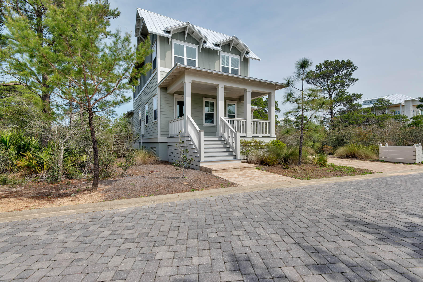 Essentially a brand new home, reluctantly left behind by a family unexpectedly transferred out of state, this Harper model built by Emerald Homes is a treasure. Festooned with many upgrades already included in a basic price, a discriminating buyer has the opportunity to move into a new residence already accessorized with hurricane windows, sophisticated lighting, Rinnai tankless hot water, privacy fencing, wainscoting, soft-close cabinets, Samsung washer and dryer, and a security system. The residential community of Highland Parks happily accommodates both full-time residents as well as vacation rentals, and all residents are thrilled with the world-class pool, viewing tower, entertainment center and dining pavilion, firepit, hot tub, walking paths, and the beach shuttle in season.