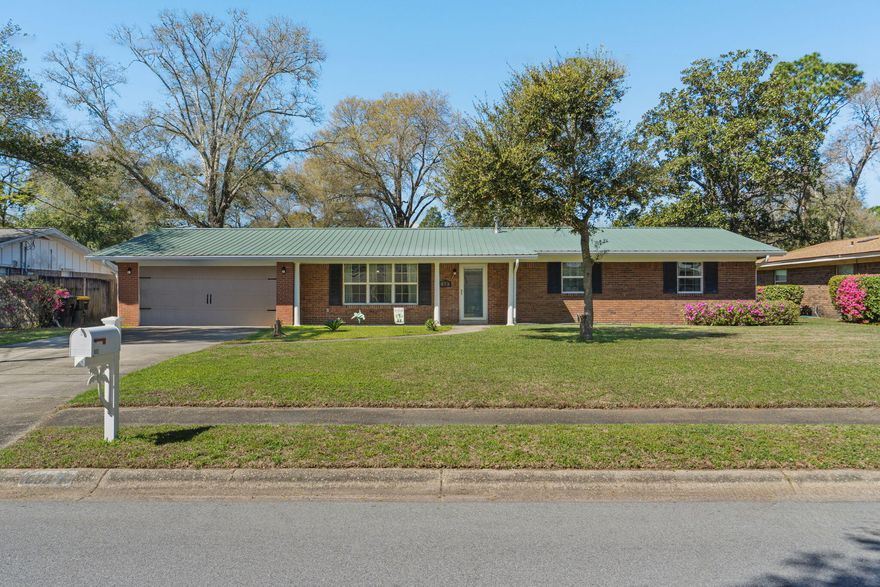 Welcome to this beautifully updated ranch-style home in one of Fort Walton Beach's most sought-after areas! Located in a sidewalk-lined community with a neighborhood park, pickleball courts, and tennis courts all within walking distance, this home offers both convenience and lifestyle. You're also walking distance to Kenwood Elementary school and just 15 minutes to the beach on Okaloosa Island, 10 minutes to Eglin Air Force base, less than 20 minutes to Hurlburt Field, and 10 minutes to the Destin-Fort Walton Beach airport! This 3 bedroom, 2 bath home also features a versatile flex room, ideal for a home office, playroom, or additional living space. Inside, you'll find two separate living areas, offering plenty of room to relax or entertain, along with a formal dining room perfect for hosting gatherings. The kitchen is thoughtfully designed with granite countertops, a breakfast bar, pantry, wall oven, built-in microwave, electric cooktop, and a refrigerator with ice and water dispenser. Just off the kitchen, the flex room/den with a wood-burning fireplace opens through French doors to a spacious 16x17 screened-in patio - an ideal spot to enjoy Florida evenings year round. Major systems have been well maintained, including a 2012 metal roof, 2012 water heater, and a brand-new HVAC system installed in 2024; and have peace of mind with a termite bond for preventative protection. Enjoy other notable features like updated windows, a fully fenced in backyard, sprinkler system, gutters, crown molding, recessed lighting, and new luxury vinyl plank flooring. And with no HOA there's even room to park your boat! This home checks all the boxes - updated, spacious, and perfectly located to enjoy the best of the Emerald Coast.