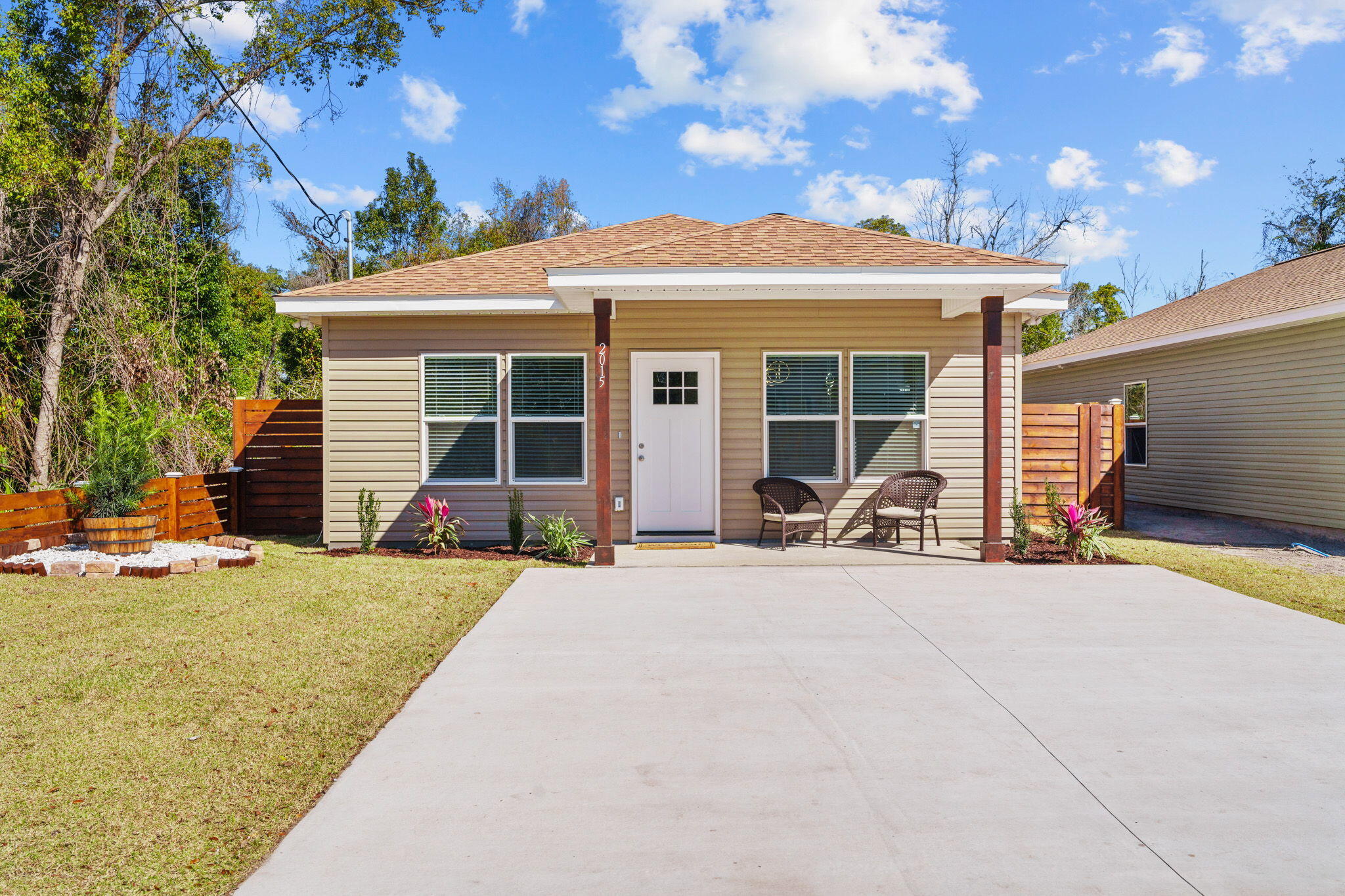 Looking for an amazing, affordable new build? Look no further! Presenting 2015 E 7th Ct, Panama City, FL, a stunning new home designed for modern living. Enjoy 9-foot ceilings that create an open feel, a spacious 7ft island with a breakfast bar, and light, warm elephant gray paint throughout. The large backyard offers endless possibilities, from gardening to adding a pool. A stained fence provides privacy and elegance. Conveniently located within close range of schools, shopping, and dining. Don't miss this opportunity--schedule your showing today!