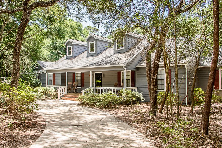 Almost 1 acre of property in Rocky Bayou surrounds this Southern style home that will be sure to charm you. Its many features include a large,33x10, covered front porch, a 21'x10' screened porch with tile flooring, a 750 SF rear deck and a sparkling 20'x40',custom depth, swimming pool. The interior of this home is light and bright with several sky Velux windows, high ceilings and tile, pine and oak flooring. The airy kitchen is the heart of this home. Custom cabinets, Corian counter tops and a cheery breakfast area. The kitchen leads to the formal dining room and living room that are seperated by french doors. The extra large utility room has plenty of cabinets as well as a built in bathtub for washing pets.Thelarge family room with its stunning brick floor is accented by a beautiful