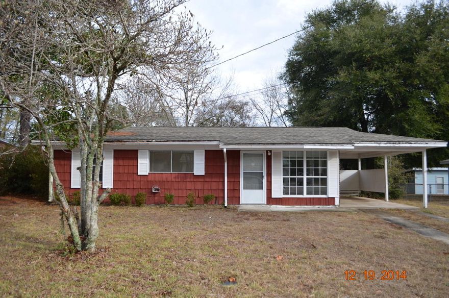 Three bedrooms and 1 and 1/2 bath. This brick siding and shake front home has fenced back yard and carport. There are several updates inside including tile, laminate, cabinets and HVAC system. Home needs some minor work outside, but priced very attractively for both the savvy investor and home owner alike!