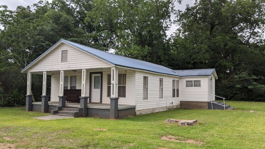 Wow! Two properties for the price of one! Quaint Home with lots of Historic Charm in the heart of Baker Florida!! Lots of upgrades and will pass a 4-pt inspection! Natural wood flooring through out main part of home and tile in baths and kitchen. Kitchen with a recent remodel, newer appliances, cabinets and beautiful tiled backsplash. Bathroom has a nice stand up tiled shower. Additional parcel to convey has potential commercial value and has a large out building that could be used for storage or potential business. It's up to you what to do with it! Come out and look at the potential of this property today!