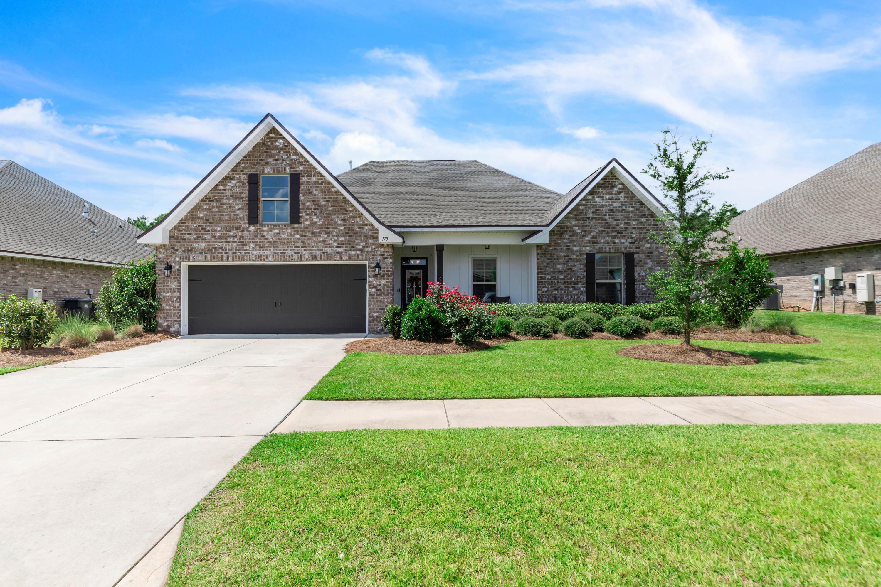 Discover 170 Campfire Cove, a breathtaking 4 bed, 2 bath retreat in Hammock Bay's Trails! This 2204 SF Craftsman beauty features an open layout with 10' ceilings, wood-look tile flooring, and a chef's kitchen with stainless appliances, quartz counters, and a spacious island. The primary suite includes dual sinks, large tiled shower, and oversized closet. Relax on the screened lanai overlooking your .3 acre private backyard. Energy-efficient with smart home tech and a tankless water heater. Hammock Bay offers resort-style living with pools, tennis, trails, bay-front clubhouse, main clubhouse and new creek side clubhouse. Thirty minutes from 30A's pristine beaches! Move-in ready with 2 car garage and lush landscaping. Residents love this premier master planned community in Freeport, FL designed for a incredible lifestyle. Spanning over 3,000 acres, Hammock Bay offers an array of amenities, including resort-style swimming pools, an 8,000 sf state of the art fitness center, lighted pickleball courts, and a 60 acre Sports Complex, just to name a few. Residents currently enjoy a General Store, Microbrewery, concerts at the amphitheater and regular Farmer's Markets in the Windmills Town Center. Truly, 170 Campfire Cove blends coastal charm with modern convenience, making it an ideal place to call home! Buyer to verify all information important to them.