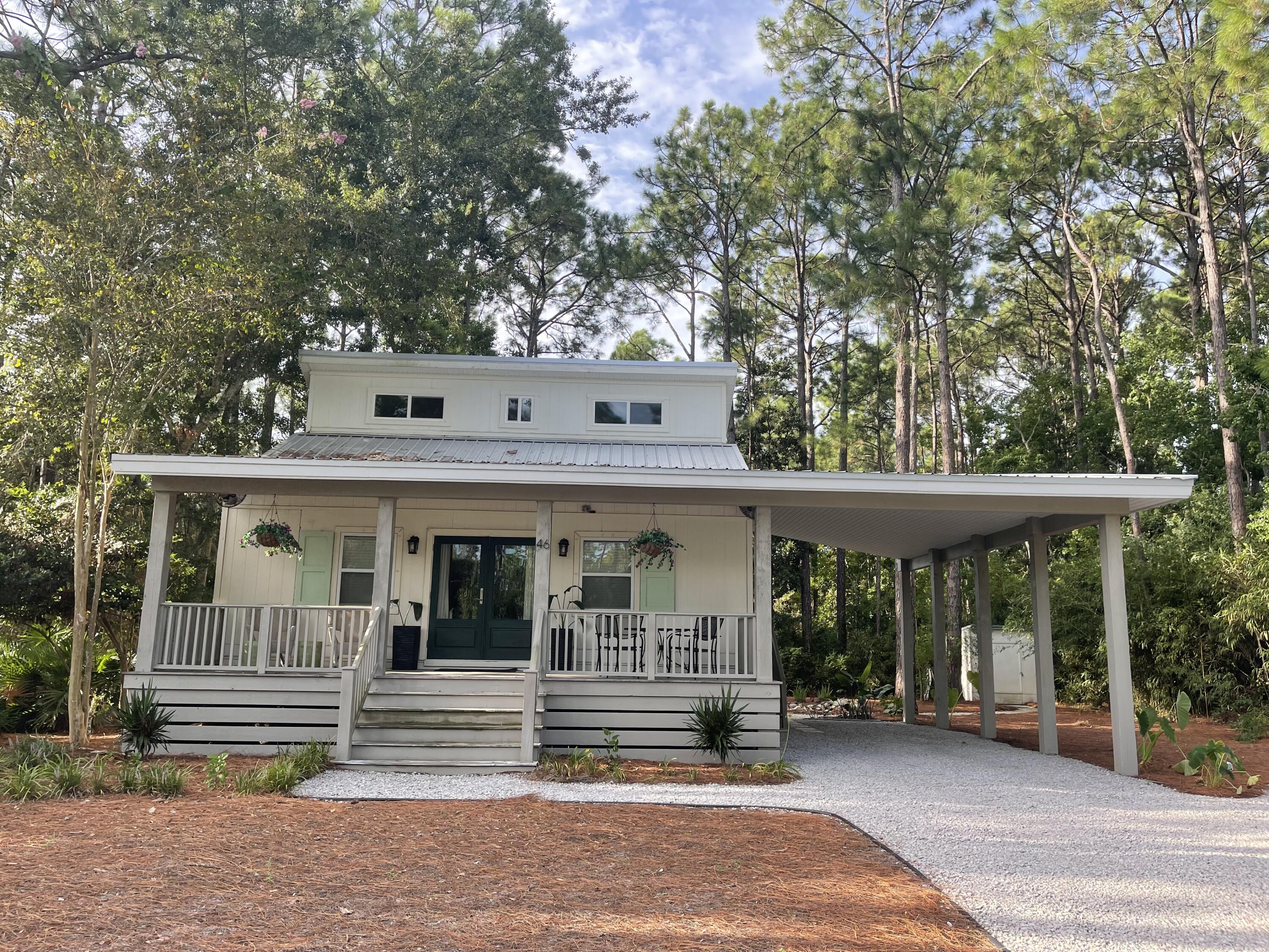**Available September 18!!**This stunning beach cottage is just minutes from the sugar-white sands and emerald waters of the Gulf. This beautiful home features an open-concept living area, a gorgeous kitchen, two spacious bedrooms, two modern bathrooms, and ample parking. Nestled on a private, meticulously landscaped half-acre lot, the property offers endless possibilities - whether you want to add a pool, outdoor living spaces, or additional structures. Located less than a mile from the Ed Walline public beach access and the world-class dining and shopping at Gulf Place on 30A, 46 Cypress Pond Lane is a rare opportunity not to be missed!