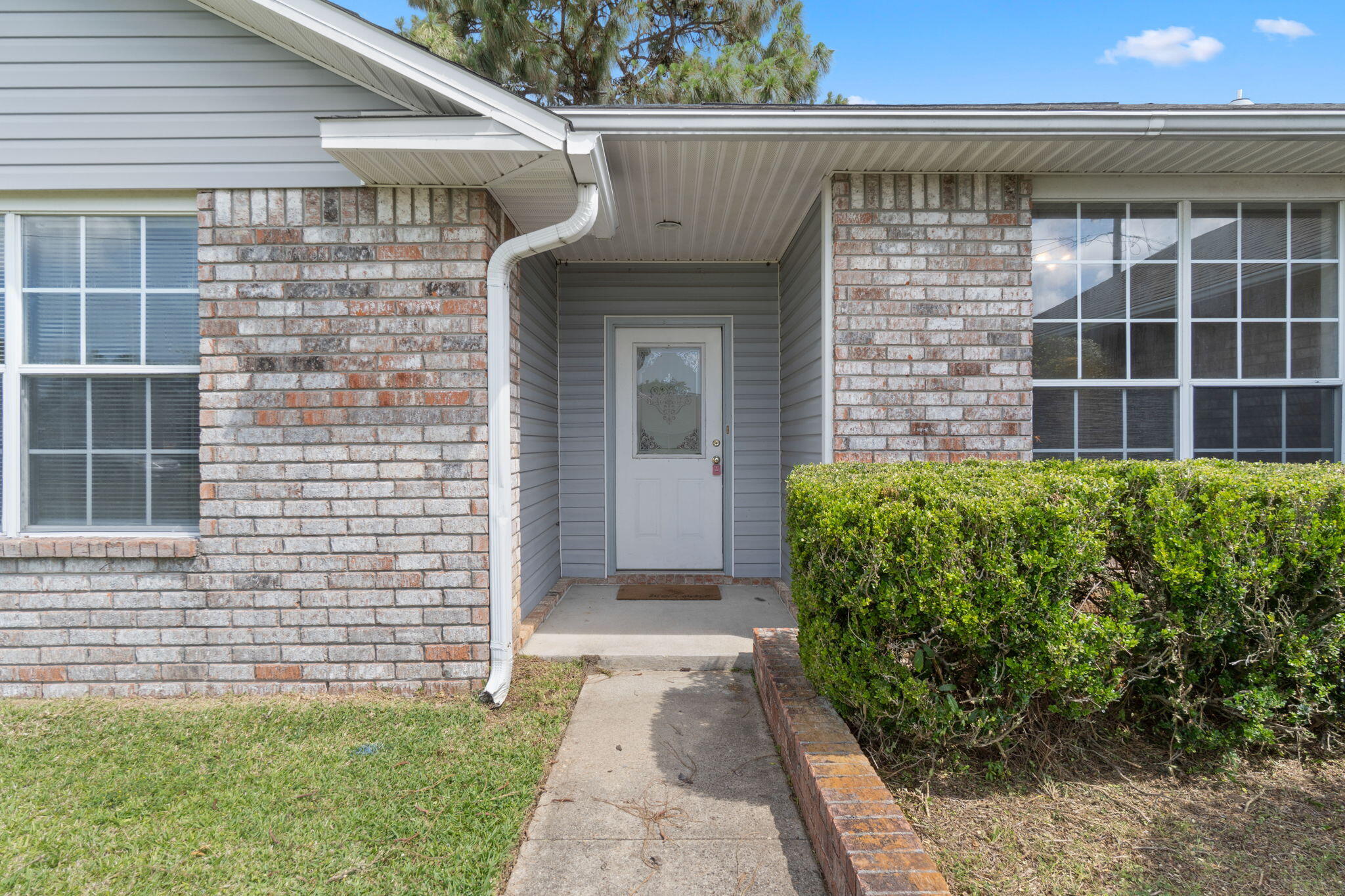 Welcome to this beautifully maintained 3-bedroom, 2-bath home in the heart of Pensacola--where comfort, space & location come together seamlessly. From the moment you walk through the front door, you're greeted by a light-filled, open floor plan that offers a warm & inviting atmosphere. Vaulted ceilings enhance the sense of space, while a soft, neutral color palette sets the perfect tone for any style of decor. At the center of the home, a cozy fireplace creates the ideal spot to gather on those few cool Gulf Coast evenings. The large eat-in kitchen offers ample counter space & cabinetry, perfect for preparing family meals or hosting friends. Just off the kitchen, the laundry room adds everyday convenience--& yes, the washer & dryer convey with the sale! Each of the three bedrooms offers ge