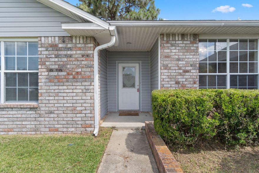 Welcome to this beautifully maintained 3-bedroom, 2-bath home in the heart of Pensacola--where comfort, space & location come together seamlessly. From the moment you walk through the front door, you're greeted by a light-filled, open floor plan that offers a warm & inviting atmosphere. Vaulted ceilings enhance the sense of space, while a soft, neutral color palette sets the perfect tone for any style of decor. At the center of the home, a cozy fireplace creates the ideal spot to gather on those few cool Gulf Coast evenings. The large eat-in kitchen offers ample counter space & cabinetry, perfect for preparing family meals or hosting friends. Just off the kitchen, the laundry room adds everyday convenience--& yes, the washer & dryer convey with the sale! Each of the three bedrooms offers ge