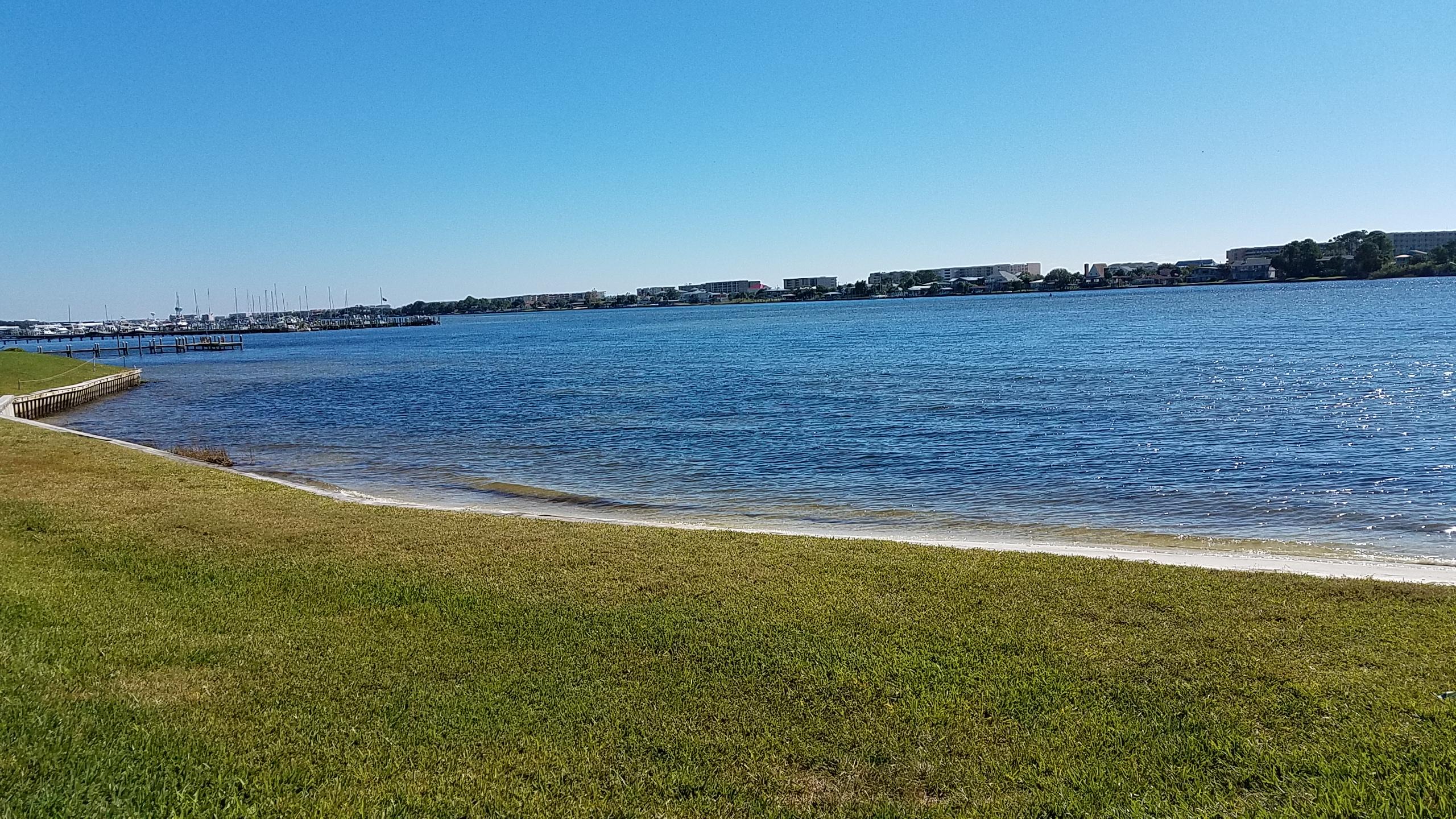 Are you looking for a waterfront lifestyle with a low carbon footprint? This is the place for you with this beautiful community situated along the inter-coastal waterway. Spend your sunny days relaxing at the waterfront community pool or drop a fishing line from the dock and soak up the sun. This home has everything you need with open concept living offering a full sized kitchen and a spacious living room that leads to the private balcony overlooking a tree lined courtyard leading to the water. While sitting on your deck you can catch glimpses of wildlife long the water. The interior living space is plentiful with double closets in the bedroom and plentiful elbow room in the bathroom. Don't let the sqft fool because this home lives big.