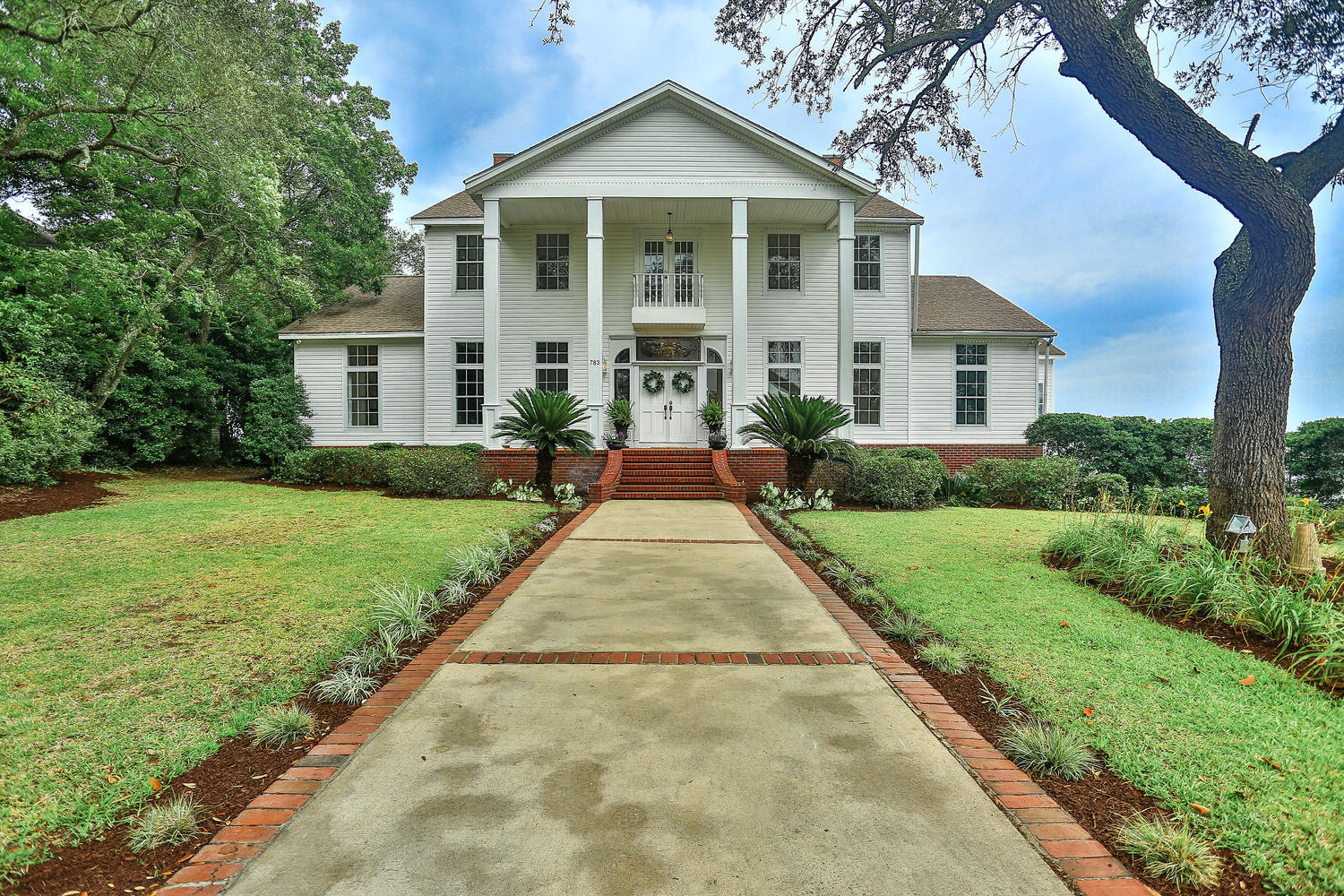 Majestic, custom-designed waterfront home on 534 feet of water frontage and 0.77 acre of land. The home is located in the desirable, Shalimar Pointe Subdivision in Shalimar, FL and has 3884 heated and cooled sq. footage with 4 bedrooms and 2.5 bathrooms. A deep water boat slip, views of a western sunset and an eastern sunrise are bonus features! The home was made for entertaining both on the interior and exterior! The entrance is a grand two-story foyer with 20' ceilings, chandelier, and a majestic staircase! The foyer leads to a great room overlooking the water with bay windows and French Doors! The great room features recessed lighting,