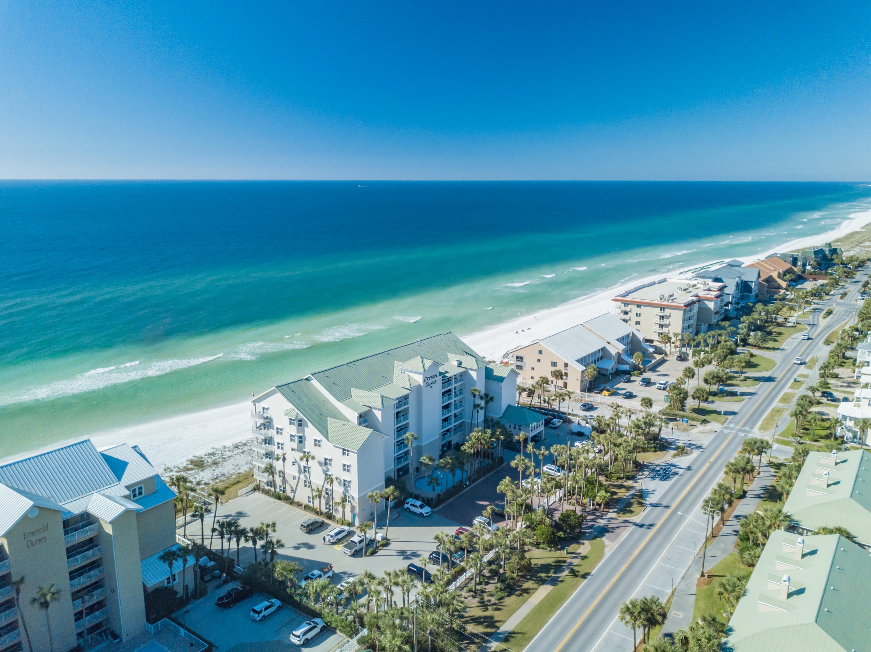Walk directly out your living room patio door to the beach from this lovely first-floor condominium residence in Crystal Beach! The unit includes a large kitchen with abundant granite counters, a large breakfast bar, and stainless appliances, which opens to the living/dining area and enjoys fabulous views of the white sand and sparkling waters! The home includes two bedrooms, two full baths, and two bunks tucked into the hallway. Crystal Dunes offers a gated entrance, private pool and private beach access. It's location toward the eastern side of Destin's beloved Crystal Beach neighborhood puts it within easy reach of fabulous restaurants, shopping, entertainment and all the best attractions of the Emerald Coast!