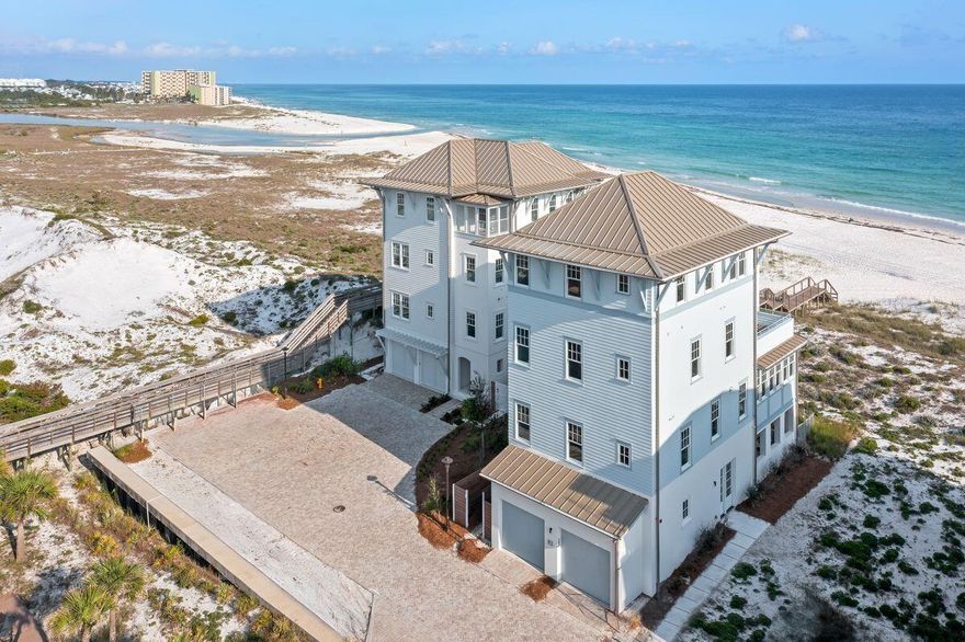 Perched on one of the widest homesites in the exclusive community of Lupin Beach, Lot 19 offers 87 feet of uninterrupted Gulf frontage and 3,667 square feet of refined interior living. Designed by Historical Concepts and brought to life by Alys Beach Construction, this four-bedroom plus flex room residence captures the essence of coastal sophistication across four thoughtfully designed levels. Inside, curated finishes reflect a balance of softness and structure--wide-plank Madeline hardwood flooring, handcrafted Zellige tile, and natural quartzite countertops anchor the palette, while aged brass lighting and satin brass fixtures lend a timeless warmth. The kitchen features white oak cabinetry, a 36" Wolf gas range, paneled Sub-Zero refrigeration, and an expansive island finished in Special Walnut stain. An elevator connects each floor, including the third level's lounge and Gulf-facing terraceperfect for sunset cocktails or morning coffee with the sound of waves.
Outside, a private plunge pool and summer kitchen invite relaxed al fresco living. Just a few yards away, Lake PowellFlorida's largest coastal dune lakeoffers tranquil opportunities for paddle-boarding, kayaking, and fishing in a protected, scenic setting.