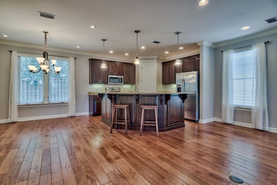 Custom built home by Huff Builders in Church Street Village. Originally an ''E plan'' that was expanded to be a 3 bedroom, 2.5 baths, 2175 square foot home with a huge office or flex room. The large open living area has 9 ft ceilings and 8 ft doors, crown molding, engineered wood flooring and surround sound speakers. The kitchen has an 11 foot granite island with breakfast bar, stainless steel appliances, and a pantry! Separate dining area with french doors out to the screened in back porch that has a brick floor and surround sound speakers too! The home sits next to the dog park and is on a perimeter lot so you have a lot of privacy! The back yard is fenced in and has a concrete patio. Lush landscaping and lawn maintenance is included in your HOA fees. The master bedroom has a large walk