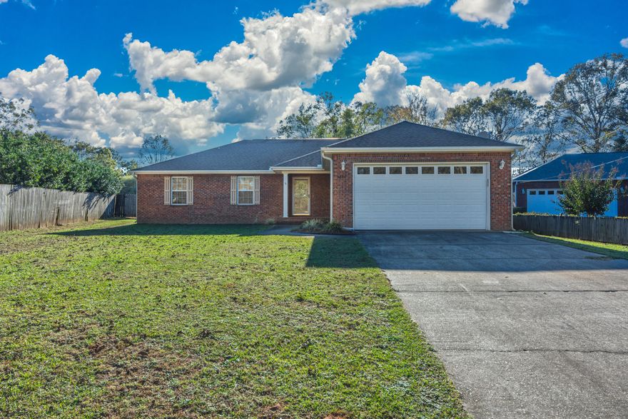 BACK ON MARKET NO FAULT OF THE SELLER....Welcome home to this brick 4 bedroom 2 bath split floor plan home features  laminate flooring in the living area and hall, vaulted ceiling in living room, large master with tray ceiling and master bath with corner garden tub, separate shower and double sinks.  Located on .56 acre level lot with fenced backyard, large insulated workshop, yard building and above ground pool