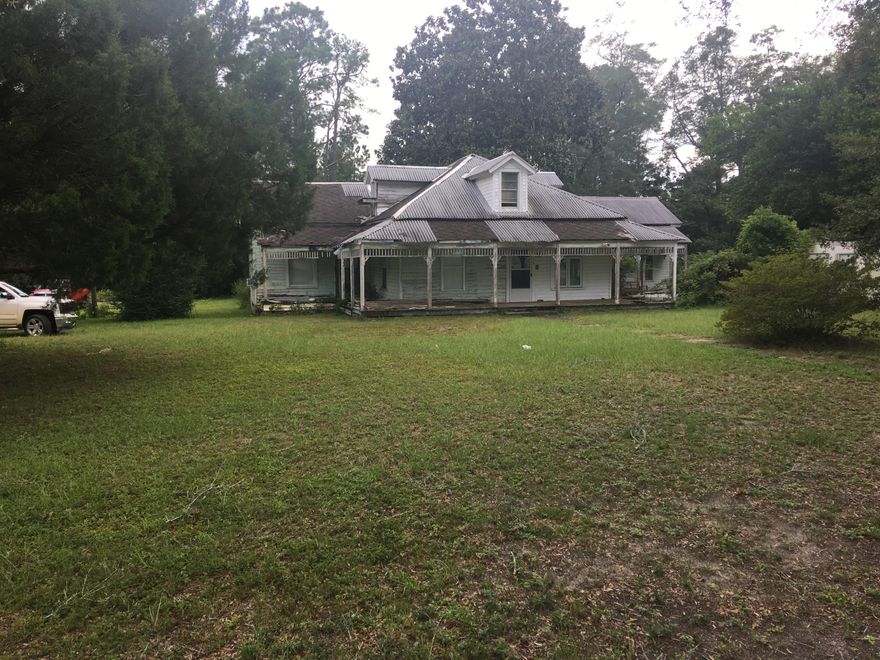 ''OPPORTUNITY KNOCKS'' It's not everyday you have the opportunity to own a piece of history. This is a solid home just waiting for the right person to bring it back to its former grandeur. Owner lives in the home and has made some improvements over the years as she has occupied. This is a project but when you walk through and see the solid construction and endless possibilities you will fall in love. Home is on 2 parcels and will be sold as one unit which gives a great sized lot with beautiful mature trees and endless landscape possibilities. This is a chance to truly own a piece of history and make it your own. Home is being sold ''AS-IS'' and any measurements or other items considered important to buyer should be verified by buyer.