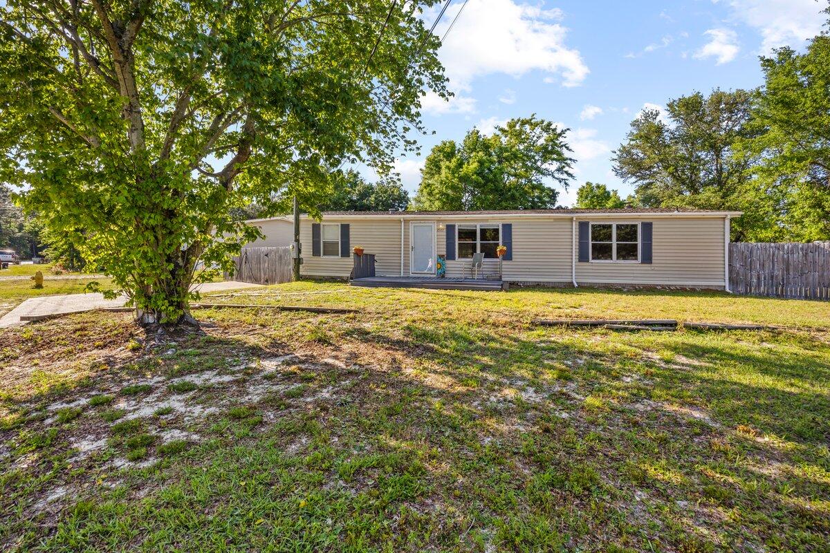Welcome to your peaceful retreat! This spacious 3-bedroom, 2-bath mobile home sits on a generously sized, fully fenced lot--over a quarter of an acre--offering privacy, space, and comfort both inside and out.Step inside to a warm and inviting family room featuring a cozy fireplace, perfect for relaxing evenings. The open-concept living and dining area provides great flow for entertaining and family time. The kitchen offers plenty of cabinetry and counter space for all your culinary needs.Enjoy your morning coffee or unwind after a long day on the screened-in back porch overlooking your private backyard--ideal for pets, kids, gardening, or simply enjoying the outdoors.This home offers the perfect balance of indoor comfort and outdoor living. Whether you're a first-time homebuyer, looking to downsize, or seeking an investment opportunity, this property checks all the boxes.
Don't miss your chance to own a slice of quiet country living with all the convenience of nearby amenities and Navarre Beach less than 10 miles away. Schedule your showing today!