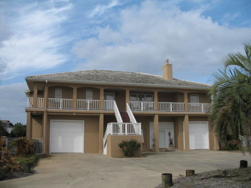 Drastic Price Reduction. Best buy on Holiday Isle.Bring you yacht. This beautiful two story home is located on Holiday Isle in Destin. The property offers two boat slips with one of the slips having the ability to dock a 60 ft. + vessel. The home features two separate living areas. The ground level portion contains three bedrooms and two baths with the upper level portion containing three bedrooms with three and one half baths. The upper and lower level is totally separated for the ultimate in privacy. Fenced lawn, swimming pool plus a two minute walk to the beach or just hail a water taxi and enjoy your cocktail on the way to the many fine dining restaurants on the Destin Harbor. What else can you ask for?