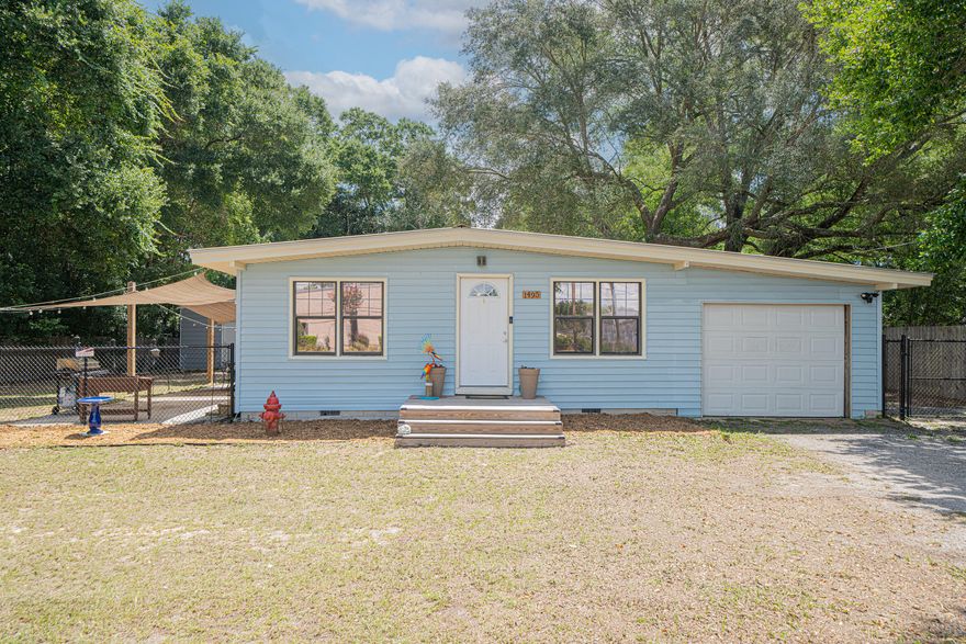 Welcome to 1495 Hickory Street, a charming 3-bedroom, 1-bath cottage nestled on a spacious 0.41-acre lot, just one block from the Mid-Bay Bridge Connector in Bluewater Bay.Built in 1963, this sweet home boasts new LVP flooring, fresh paint, an updated bathroom vanity, and vaulted ceilings that create a light, bright, and open living space. The cozy living room seamlessly flows into an open dining area and kitchen. New sliding glass doors lead to the side yard and patio, perfect for relaxing or entertaining.The outdoor space truly sets this property apart. Enjoy unwinding under the sunshades, magical evenings under the cafe lights, or stargazing by the fire pit. You'll have plenty of room to spread out with a 35x24 metal garage (featuring power and three garage doors), a 24x24 pole barn, a powered shed, and an additional storage shed. The carport adds even more functionality with a laundry room and a garage door for added privacy.

Additional highlights include:

* New chain-link front fence and wooden gate at the back
* New front and side porches/stairs
* No HOA
* Metal Roof (2008)

Whether you're a first-time buyer, looking to downsize, or seeking a smart investment, this charming, move-in-ready gem with immense potential is a must-see!

* Water Heater 2008   *HVAC 2009