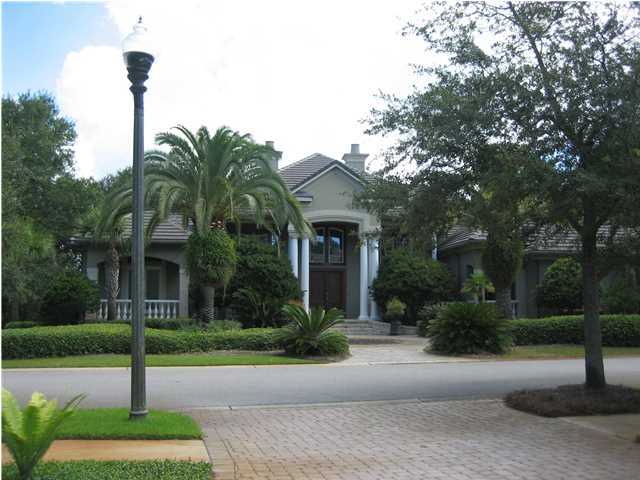 Bank Owned!! Seller financing available with low interest rate! Come take a look at this amazing property! This impressive 4 bedroom/4 bath home is truly a builder's masterpiece. The mahagony front doors open to a dramatic foyer and entryway featuring Travertine, Limestone and Brazillian Walnut Floors with Mosaic accents. The living room features one of five fireplaces with custom mantels and columns. The souring great room with built in entertainment center is set off by the great room. The loft overlooks the great room with views of the enclosed pool, lake and golf course. The Chef's Kitchen features Thermadore appliances including a double convection oven and warming drawer. With 18 foot ceilings and large crown moldings, the Lotron lighting system allows the lighting to be adjusted