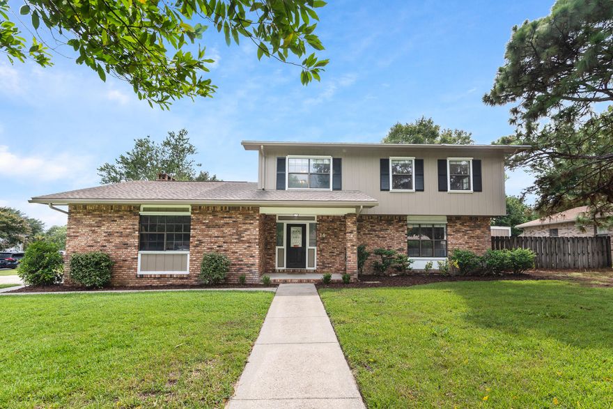 Stunning, completely renovated pool home in the established neighborhood of Lake Lorraine is a must see! Vinyl wood plank flooring throughout gives this open floor plan a cohesive flow. A custom built in bench with storage in the entry gives you a taste of this home's farmhouse style character. Two living areas allow for plenty of entertaining space, a home office, or flex space. The kitchen is open to the dining room and features brand new shaker cabinetry, subway tile backsplash. granite counters, under-mount over-sized farmhouse sink, and stainless steel appliances. Just off the kitchen is a den with wall to wall brick fireplace. Half bath is conveniently located downstairs. The large Master suite can comfortably fit a king-sized bed and all your furniture. A sliding barn door leads