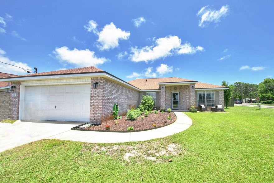 Gorgeous home on a corner lot with a huge fenced in back yard! Come see this lovely 4 bedroom and 2 bath home in Navarre, FL with a new dimensional shingle roof (2021)! Palm trees and gorgeous landscaping!!  This home features an updated kitchen with stainless and black appliances to include the French door refrigerator, built in microwave, stove and oven and dishwasher! There is a center island, granite countertops, new oil rubbed bronze hardware, and a white subway tiled backsplash! The home has vaulted ceilings and new interior light fixtures! The master bathroom has a double vanity, soaking tub, walk in shower and features a large custom mirror! There is a split bedroom floor plan with the master bedroom on one side and the three guest bedrooms on the opposite side of the home!