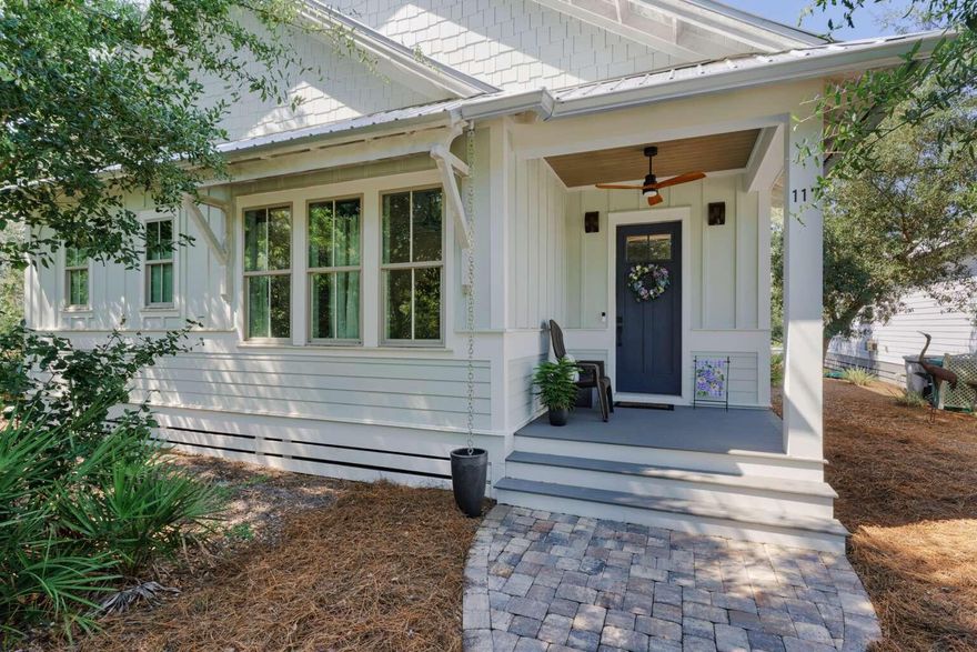 Located in the Point Washington Road community with access to all the outdoor activities that South Walton has to offer, 117 Devlieg Avenue is ideal as either a primary home or vacation home! The spacious single-story floorplan with 10-foot ceilings features 4 bedrooms, an office, separate living and kitchen spaces, and a central exterior porch, as well as a full 3-car garage. As you enter the home, step into a dedicated foyer area that opens up to both the office space with front-yard view and the large main living space with 12-foot ceilings and custom trim accents. A secondary bedroom with en-suite bath is located to the front of the home. Two additional guest bedrooms with a shared bathroom are located centrally. The separate kitchen features ample storage and counter space, and GE Profile appliances meaning that there is always room for cooking a fine meal. The private master bedroom at the rear of the layout features a wood-plank tray ceiling, and a gorgeous private bathroom with walk-in closet. The central porch can be accessed from the dining space. There is parking space for 3 full-size vehicles in the detached garage, and three more can fit in the driveway. For boaters and kayakers access to the Choctawhatchee Bay is located just one block away via a hidden-gem public boat-launch into McQuage Bayou. If you prefer walking or riding to the Bay, the nearest public access is less than a half-mile down the street. And for hikers, Point Washington State Forest runs the length of Point Washington Road, just a block South. With a central porch, a stand of old-growth in the front yard, and HOA-maintained greenspace directly across the street, the home provides nature and seclusion--even in the midst of a vibrant neighborhood with conveniently-located community pool and nearby to dining and shops. With a mix of private comfort inside and immediate access to a variety of natural wonders outside, this beautiful custom home is uniquely situated to provide everything you are looking for.