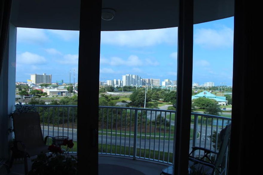 This is a fifth floor unit with very nice views to the west and many upgrades including kitchen sink, plumbing fixtures, newer stove and microwave. The spacious living area includes an entertainment center, new television, nice sleeper sofa, upgraded light fixtures. Bedrooms include new bedding, new televisions, new ceiling fans, and a custom cabinet bookcase bed in second bedroom. Bathroom fixture improvements and upper end washer and dryer were included in the recent remodeling. The resort includes an 11,000 square foot lagoon pool with waterfall and children's pool, playground, tennis courts, basketball courts, fitness center, seasonal shuttle service to beach, and covered parking. The association includes electricity, water, cable, internet and local phone service.