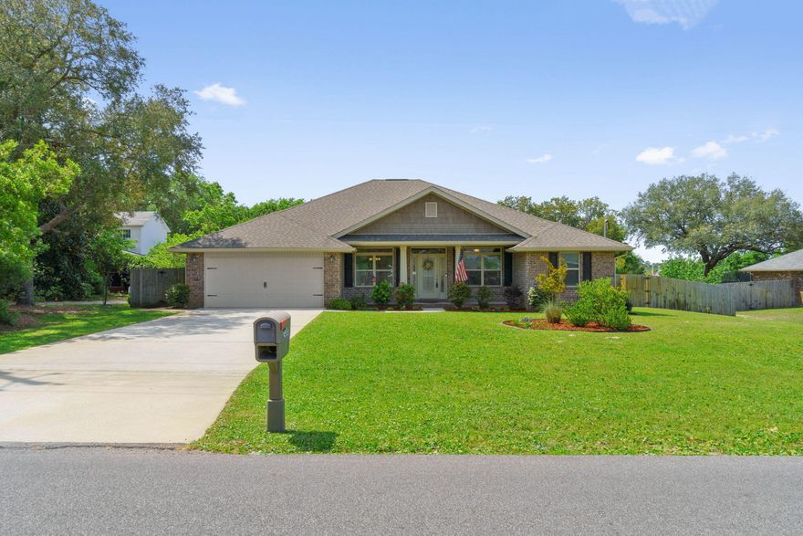 LOCATION, LOCATION, LOCATION...This immaculate residence, located within Holley By The sea, just off the East entrance, has the luxury of no HOA restrictions! Perfectly situated, this property ensures easy access to essential shopping areas, pristine beaches, and is a brief walk from the local elementary school, placing everything you need within easy reach.This all-brick residence is set on a spacious half-acre lot, complete with fenced back yard & large covered Lanai, making it an ideal setting for relaxation or hosting gatherings. Inside, the house dazzles with a luminous open floor plan that showcases high ceilings and allows for an abundance of natural light. The living space flows seamlessly into a gourmet kitchen with stainless steel appliances, breakfast bar and granite countertops making it perfect for culinary exploits. The home's layout includes plush carpeting in all bedrooms for added comfort. The master suite is a retreat in itself, featuring French doors that open to a tranquil lanai, dual vanities, two walk-in closets, a sumptuous soaking tub, and a separate shower for ultimate relaxation. An additional highlight is the fourth bedroom which also offers direct access to the rear patio through a French door. Other notable features include a large laundry room & hurricane shutters. This residence is not just a house, but a home that offers a blend of luxury, comfort, and a superb location. Make it yours and experience the best of coastal living with the freedom from HOA constraints.