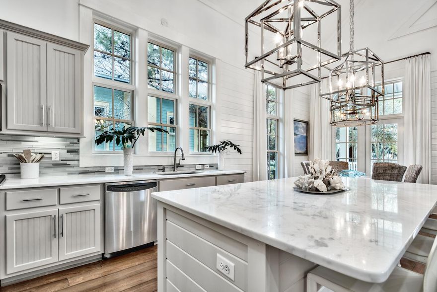 This completely renovated Watercolor home has 4BR/3.5 BA and includes 2 master suites. The designer renovations include custom drapery & rods, 3in. wood plantation shutters, marble counter tops, GE profile stainless steel appliances, new cabinets, hardware, light fixtures, gorgeous gas fireplace, luxurious soaking tub, and was completely repainted inside and out. Soaring ceilings, tall windows, and large porches provide openness and plenty of room for your family and friends to gather. Enjoy open concept living, a spacious gourmet kitchen with new 6 burner gas range, wide-plank wood floors, and master bedrooms on each level. 3 new pools & lazy river at Camp Watercolor are steps away. The furniture is brand new & the home is being sold mostly furnished.