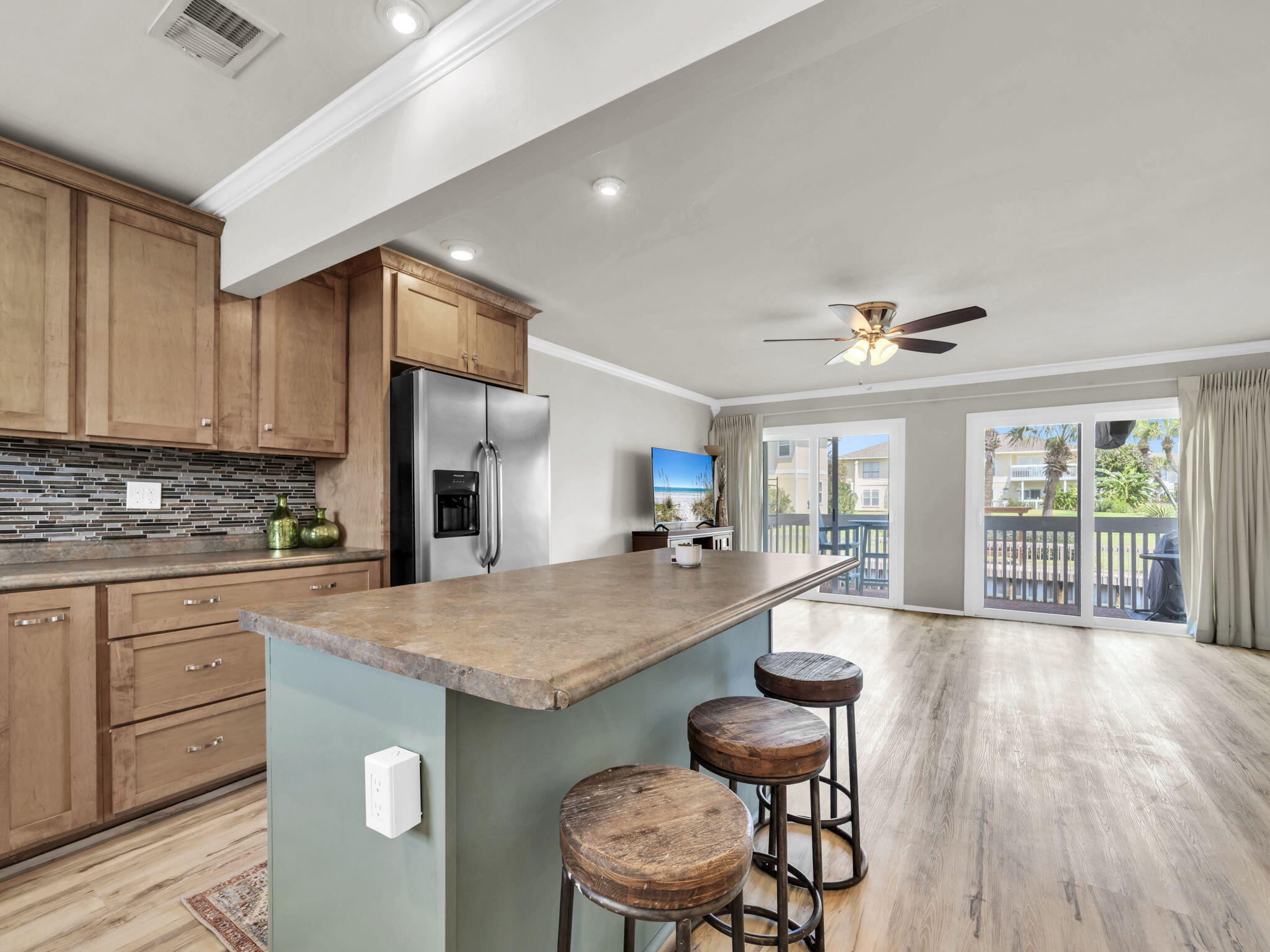 Welcome to your cozy coastal cottage on the canal at Sandpiper Cove! This updated 2BR/2BA condo is partially furnished and features new luxury vinyl plank flooring throughout and fresh paint. The open kitchen design--remodeled to include a spacious island and open sightlines to the living area--makes this condo stand out from the rest. Start your mornings with coffee on the balcony overlooking the canal that leads to Destin Harbor. Sandpiper Cove is a gated community with 43 acres of resort-style amenities including private beachfront, 5 pools, tennis/pickleball, golf, and marina. Residents and guests enjoy 1,100 feet of deeded beach with seasonal beach service, a 9-hole par-3 golf course, 6 tennis/pickleball courts, 5 pools, and a full-service marina with boat slips. On-site dining at Louisiana Lagniappe offers one of Destin's favorite waterfront restaurants just steps away. Perfect for a primary home, vacation retreat, or income-producing property, this canal-front cottage combines charm and comfort with the best of Destin's beach and harbor lifestyle.