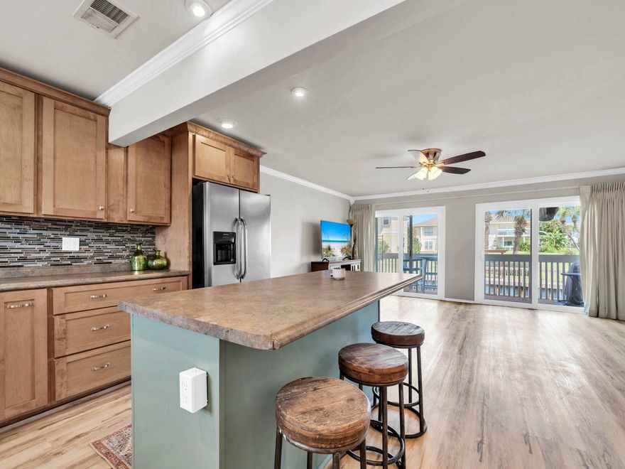 Welcome to your cozy coastal cottage on the canal at Sandpiper Cove! This updated 2BR/2BA condo is partially furnished and features new luxury vinyl plank flooring throughout and fresh paint. The open kitchen design--remodeled to include a spacious island and open sightlines to the living area--makes this condo stand out from the rest. Start your mornings with coffee on the balcony overlooking the canal that leads to Destin Harbor. Sandpiper Cove is a gated community with 43 acres of resort-style amenities including private beachfront, 5 pools, tennis/pickleball, golf, and marina. Residents and guests enjoy 1,100 feet of deeded beach with seasonal beach service, a 9-hole par-3 golf course, 6 tennis/pickleball courts, 5 pools, and a full-service marina with boat slips. On-site dining at Louisiana Lagniappe offers one of Destin's favorite waterfront restaurants just steps away. Perfect for a primary home, vacation retreat, or income-producing property, this canal-front cottage combines charm and comfort with the best of Destin's beach and harbor lifestyle.