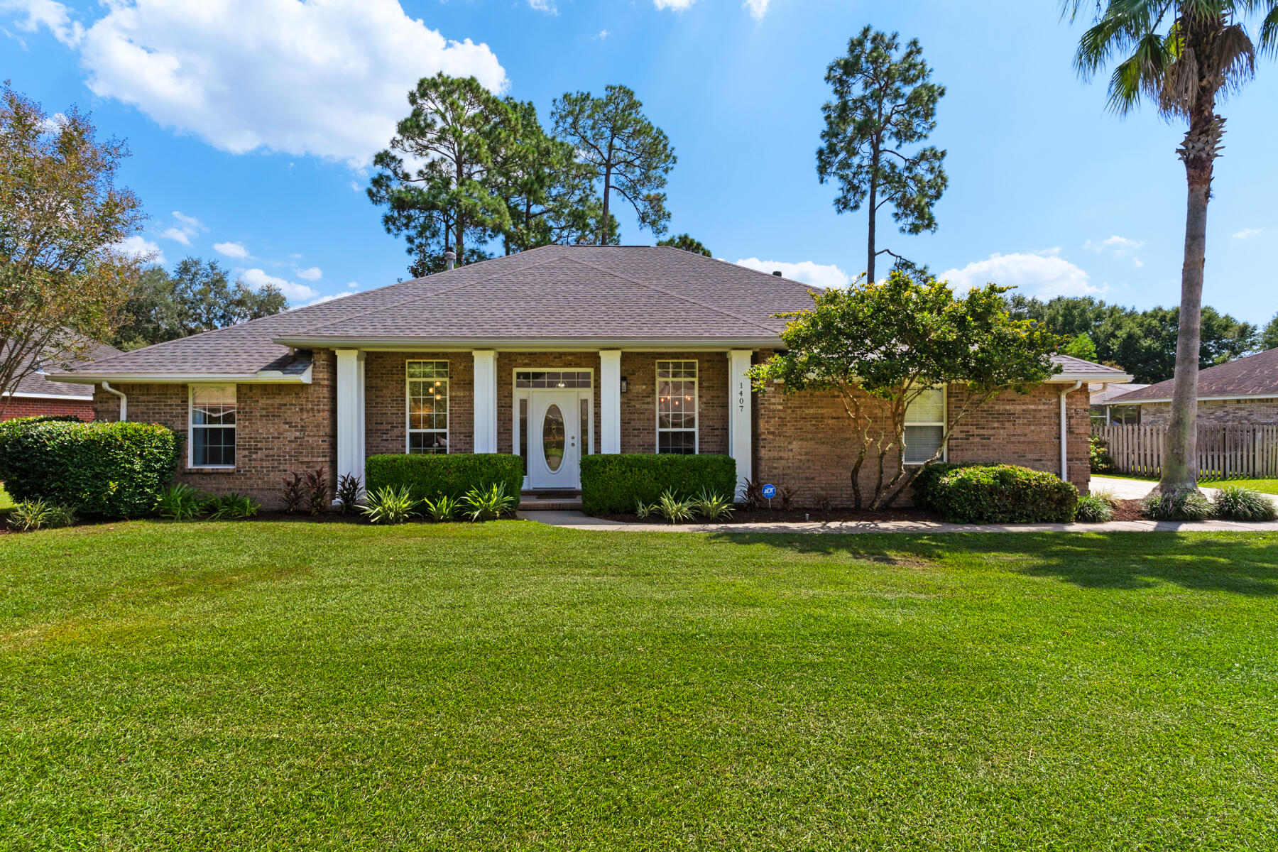 Welcome to this exceptional designer's personal home, where no detail has been overlooked in a complete, top-to-bottom renovation. Located in the exclusive, gated community of Bluewater Bay in Niceville, this 4-bedroom, 3-FULL bath home blends comfortable luxury with modern style. Situated on a quiet cul-de-sac, this stunning home offer privacy and tranquility, perfect for those seeking a beautiful and peaceful retreat. Upon entering, you'll be greeted by an open and airy floor plan featuring high ceilings and abundant natural light. The updated eat-in kitchen boasts stainless steel appliances, fantasy brown granite countertops, white cabinets, and the perfect breakfast bar that serves as the entertaining gathering spot. Adjacent to the kitchen is a formal dining room, ideal for -->