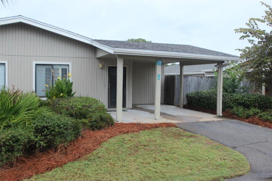 Seascape Tennis Villas. These units seldom come on the market.This 2 bedroom, 2 bath condo in Seascapes Tennis Village would be the perfect residence or furnished rental investment! What an awesome location, close to tennis courts, beach access, golf courses and restaurants. The condo features tile flooring, an open living area, fenced patio area and a 1 car carport.